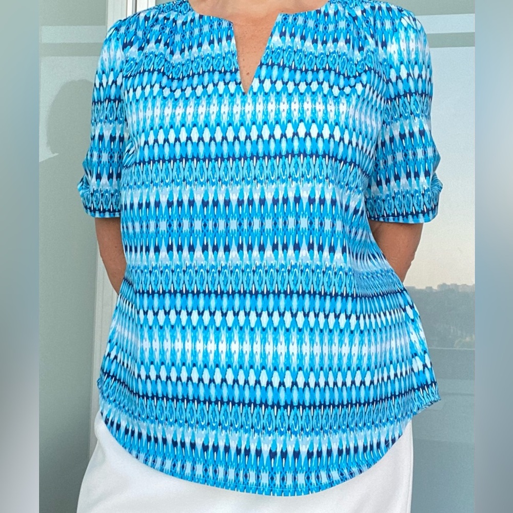 Women’s vibrant blue top, 100% polyester, easy care, perfect for office